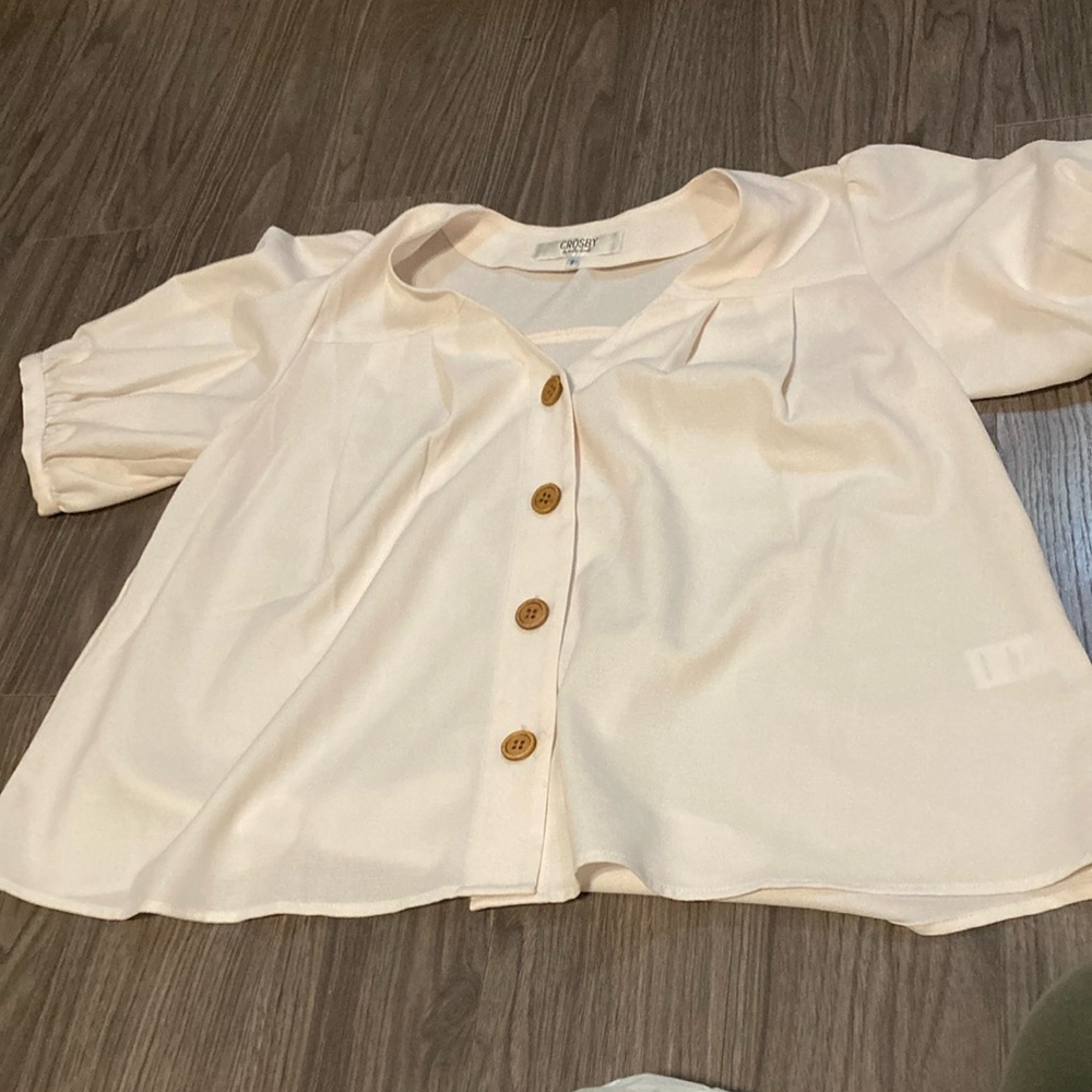 Size-small color- light pink with brown buttons.